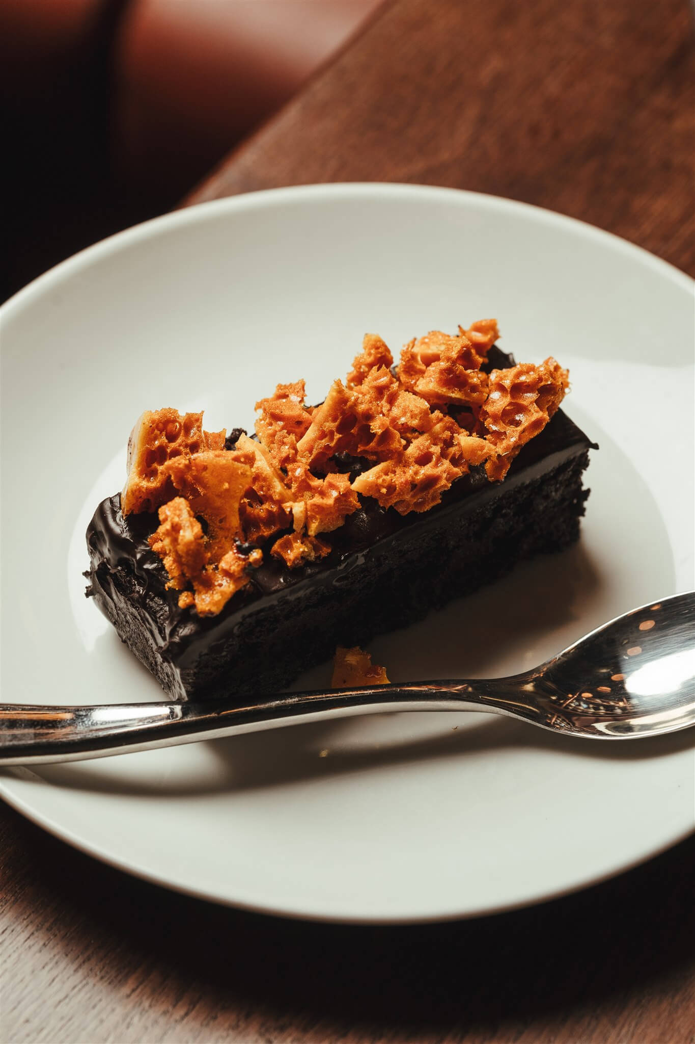 Chocolate slice topped with cracked honeycomb
